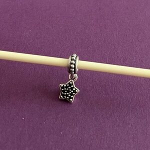 Pandora retired pave star dangle charm.